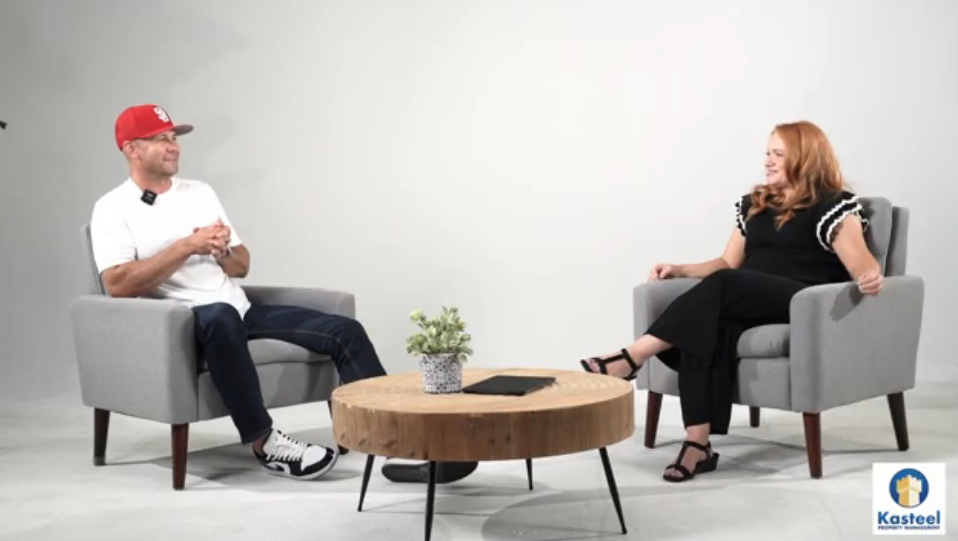 Adam and Kim sitting in a studio talking